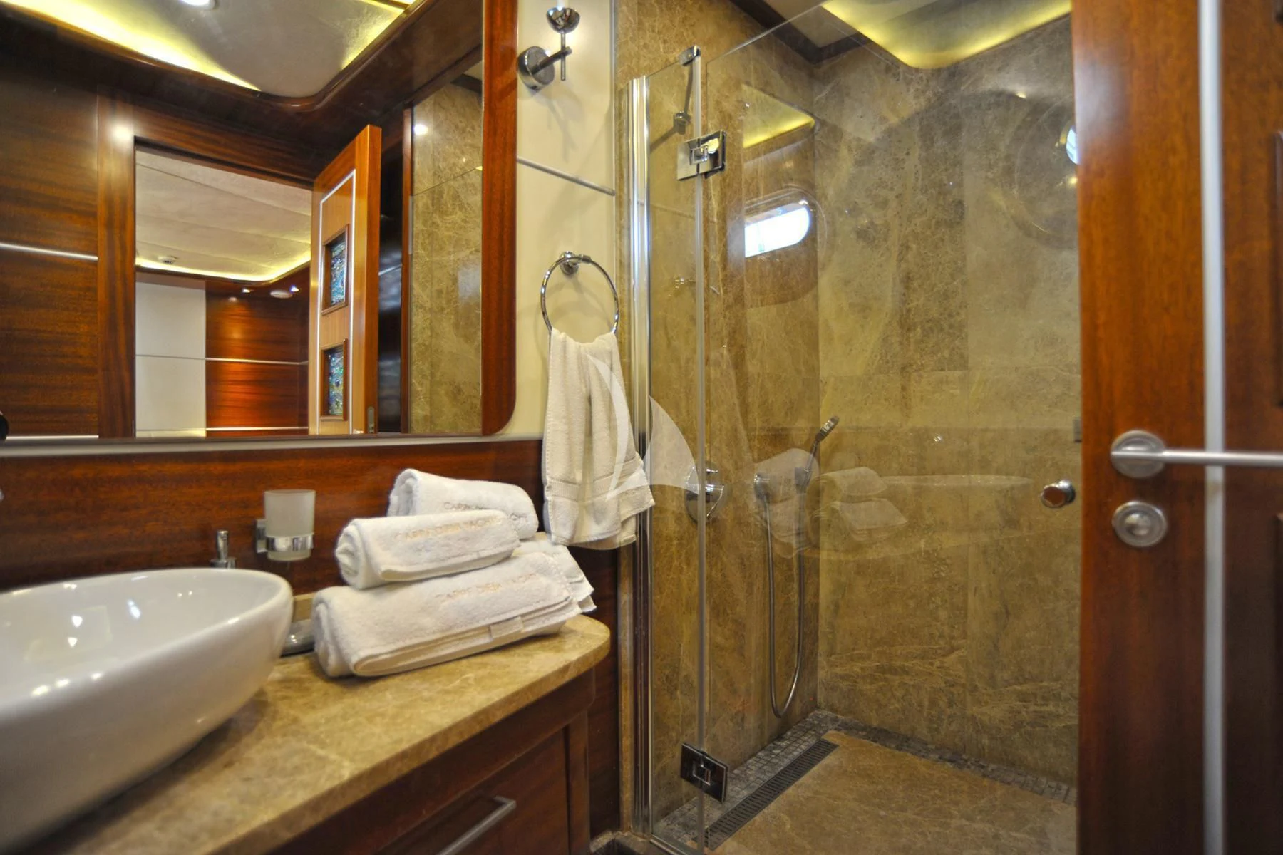 a bathroom with a glass shower aboard LA BELLA VITA Yacht for Sale