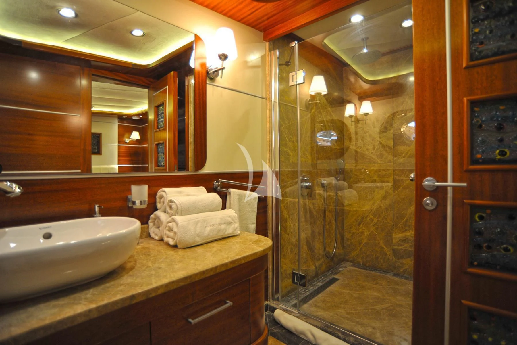 a bathroom with a shower and sink aboard LA BELLA VITA Yacht for Sale