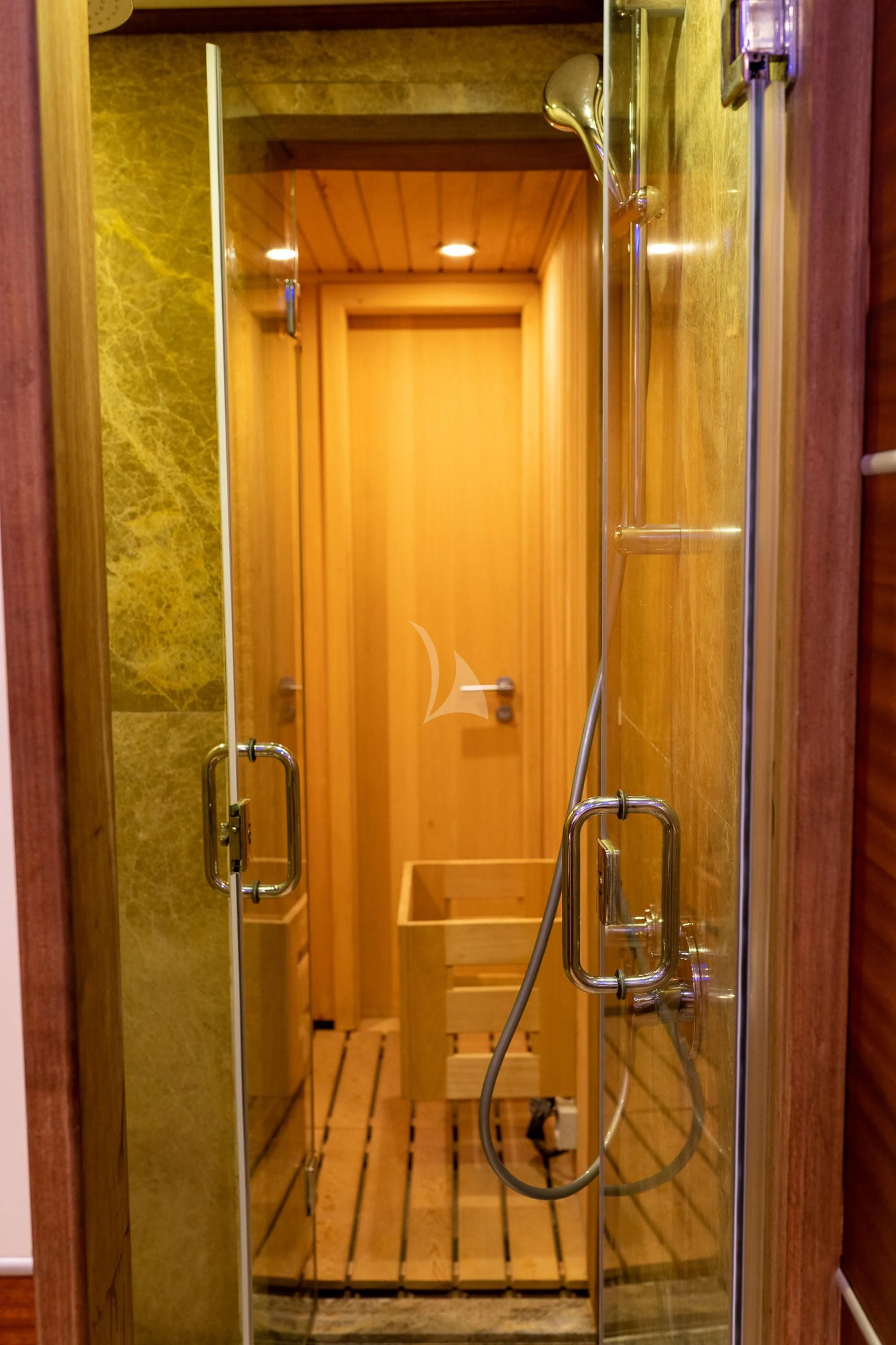 a bathroom with a glass shower aboard LA BELLA VITA Yacht for Sale