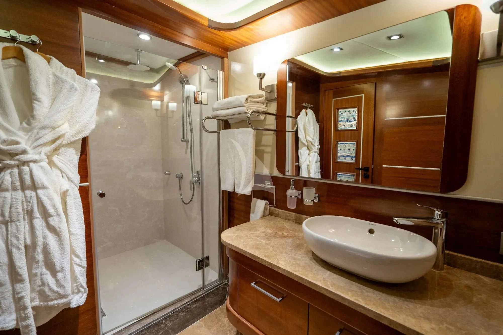 a bathroom with a sink and a mirror aboard LA BELLA VITA Yacht for Sale