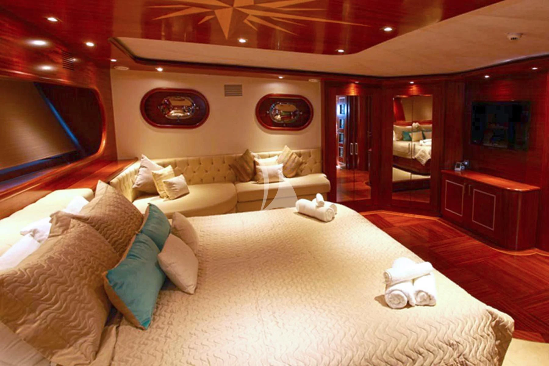 a living room with a large bed aboard LA BELLA VITA Yacht for Sale
