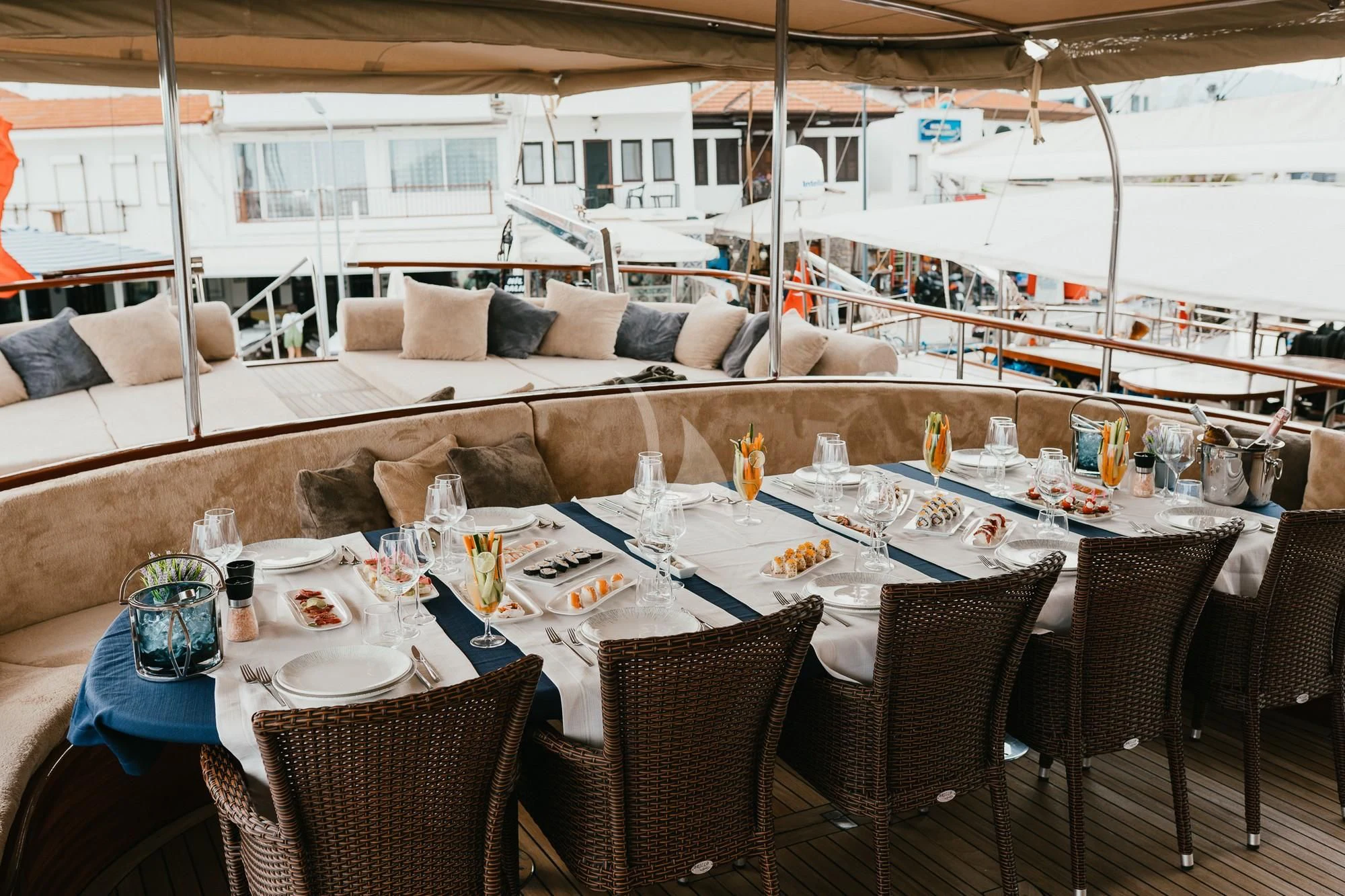 a table with chairs and a couch aboard LA BELLA VITA Yacht for Sale