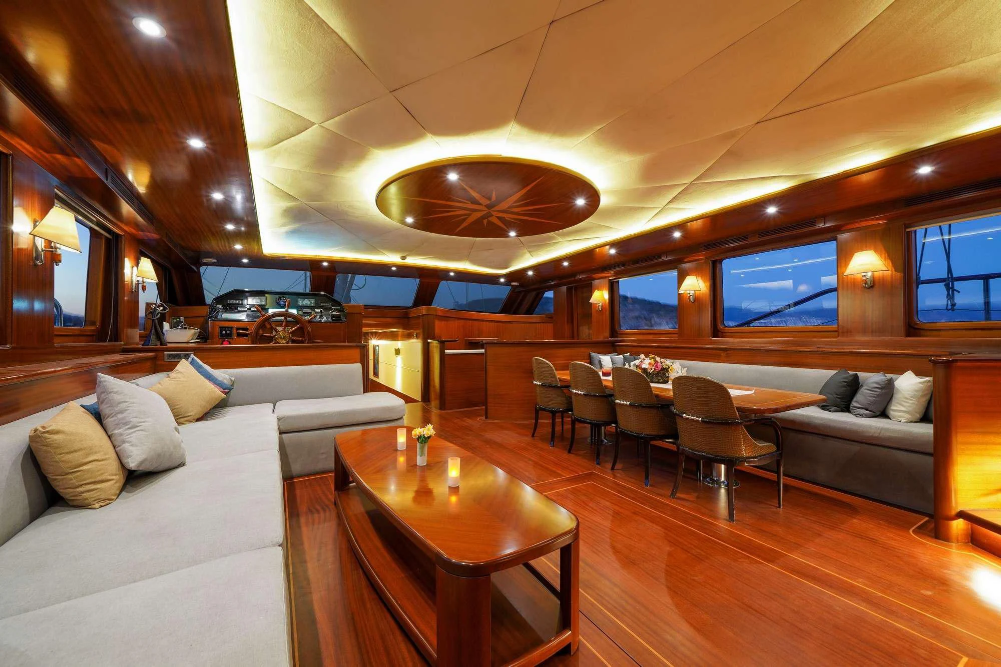 a room with a couch and a table and chairs aboard LA BELLA VITA Yacht for Sale