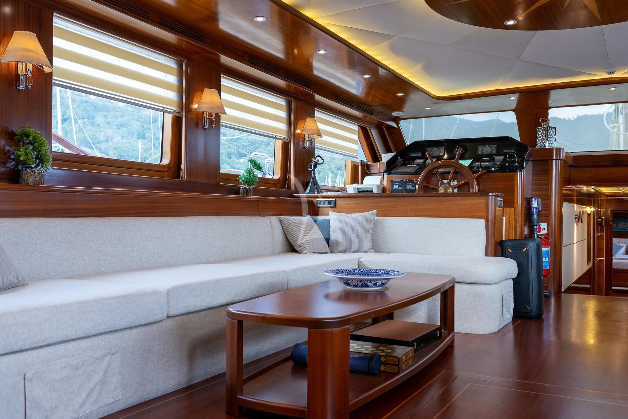 a living room with a couch and a table aboard LA BELLA VITA Yacht for Sale