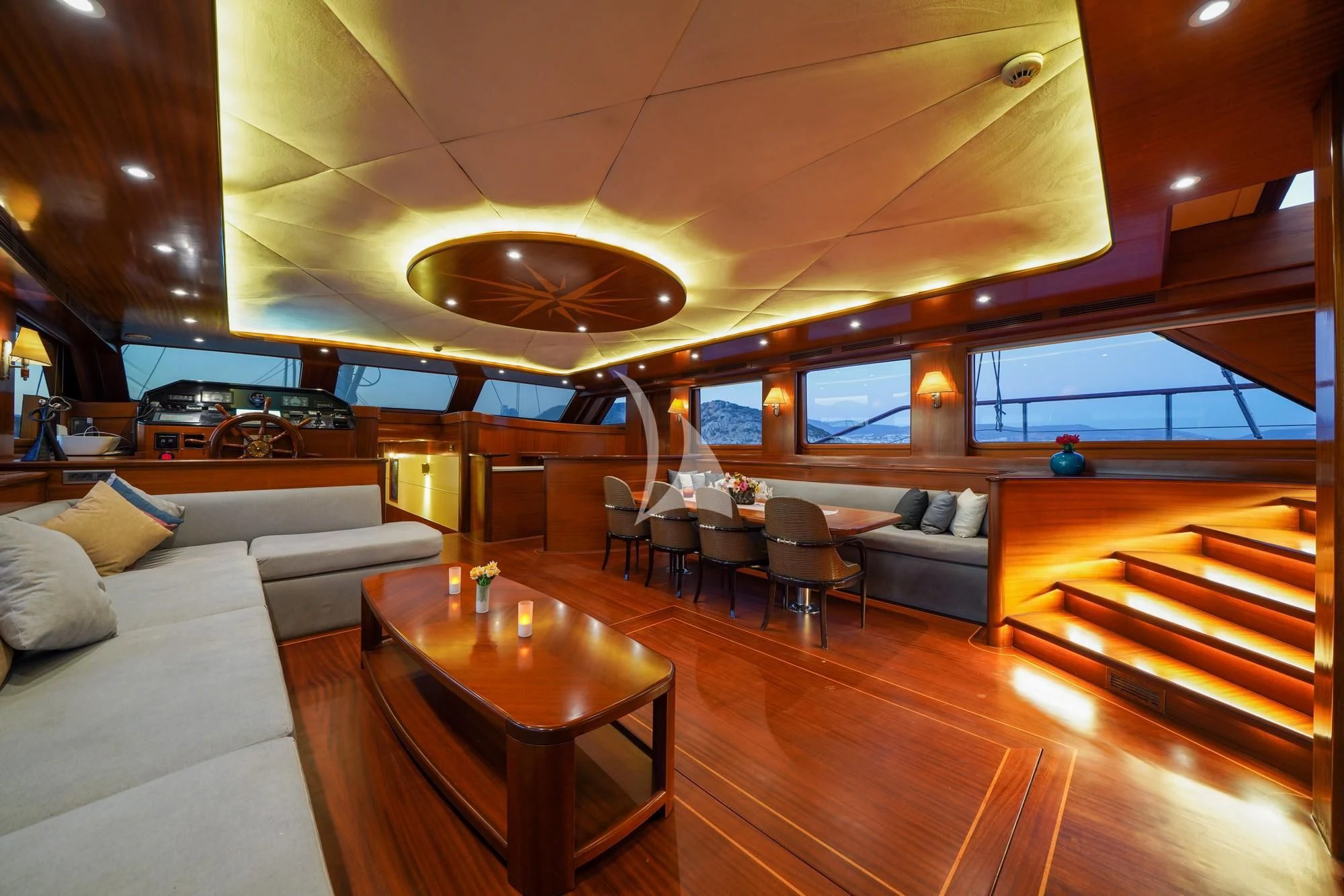 a room with a table and chairs aboard LA BELLA VITA Yacht for Sale