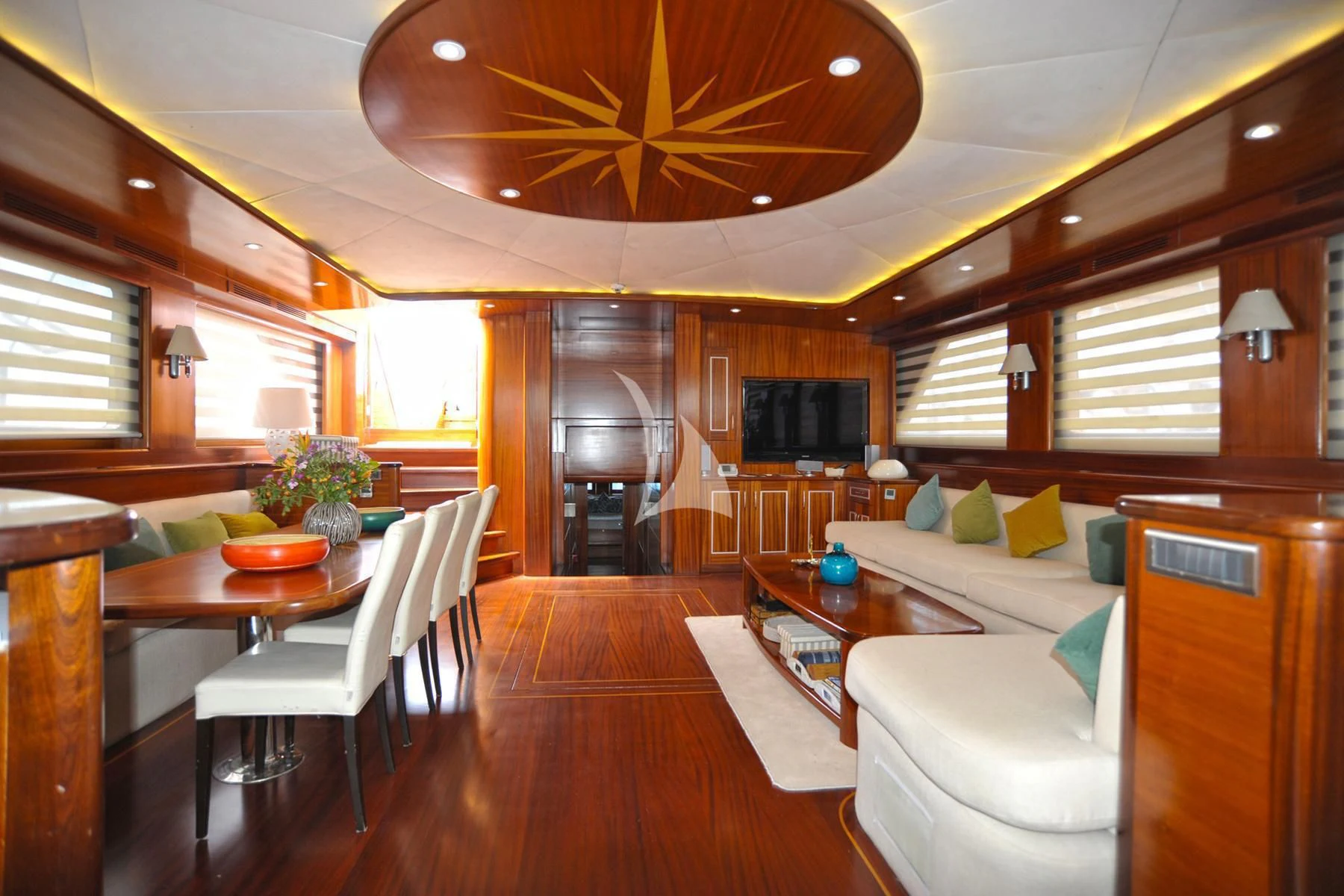 a living room with a wood floor aboard LA BELLA VITA Yacht for Sale