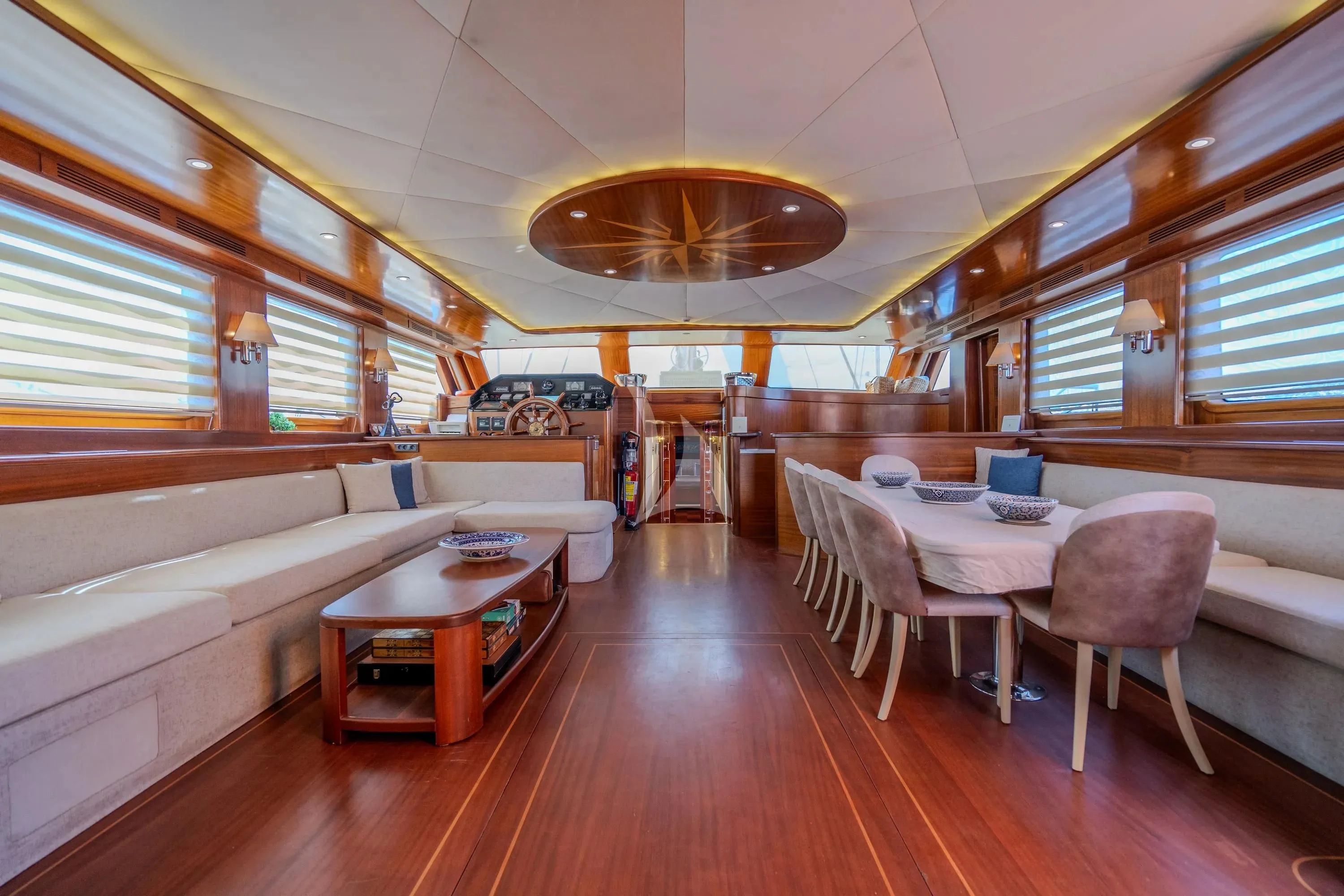 a room with a table and chairs aboard LA BELLA VITA Yacht for Sale