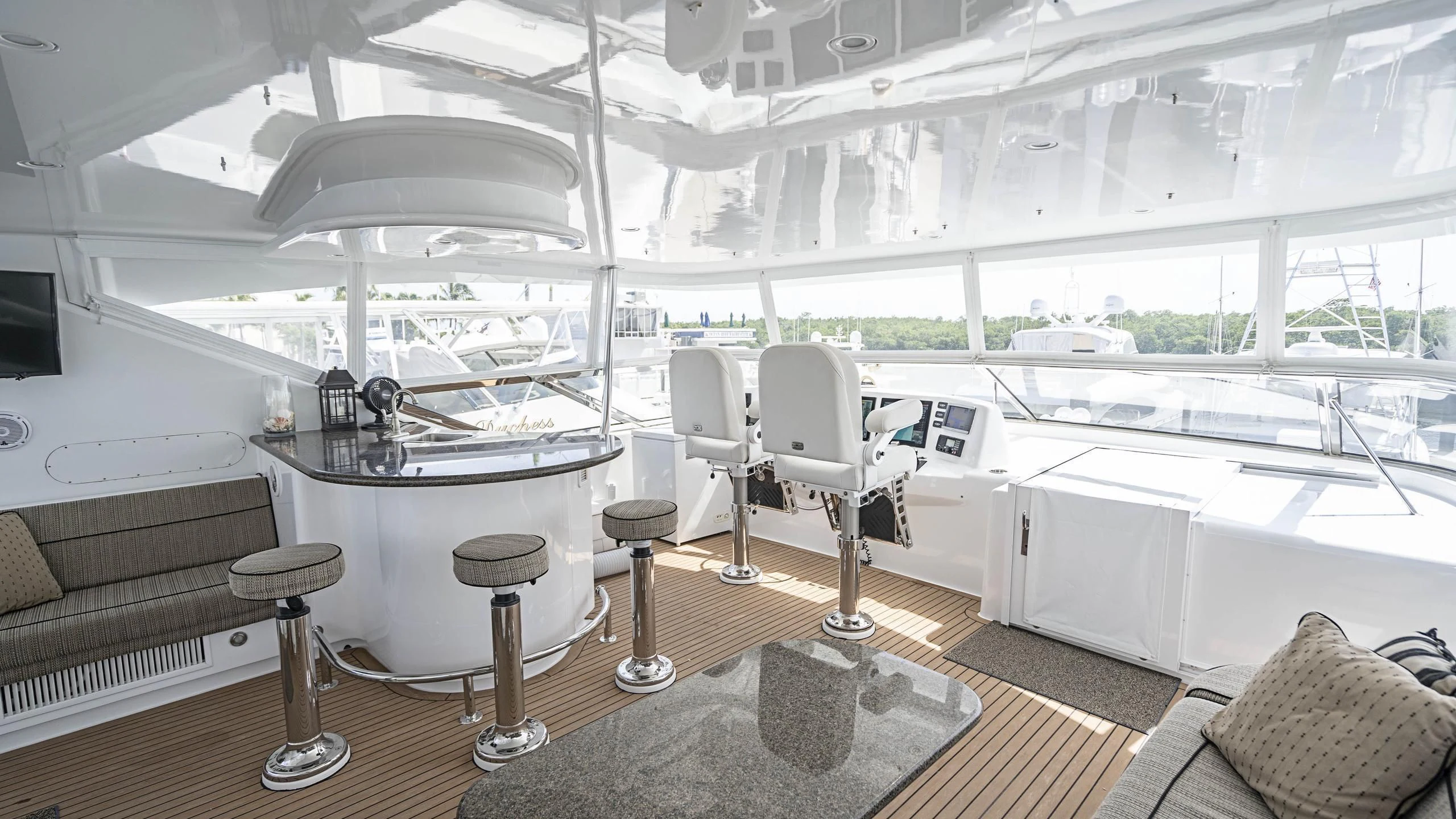 a room with a table chairs and a couch aboard AL-JUBAIL Yacht for Sale