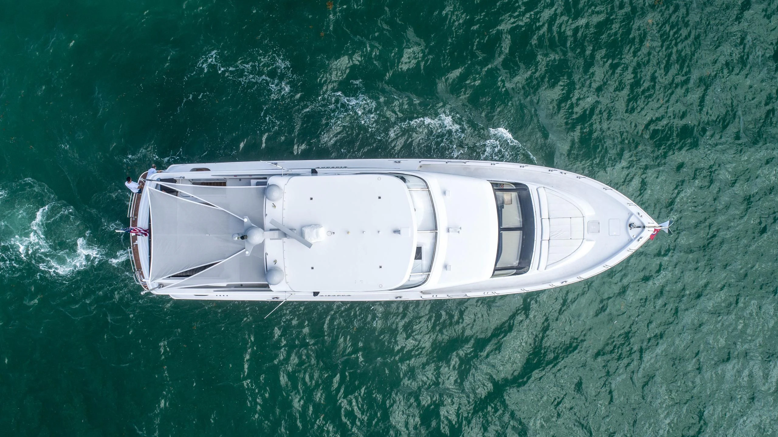 a white boat in the water aboard AL-JUBAIL Yacht for Sale