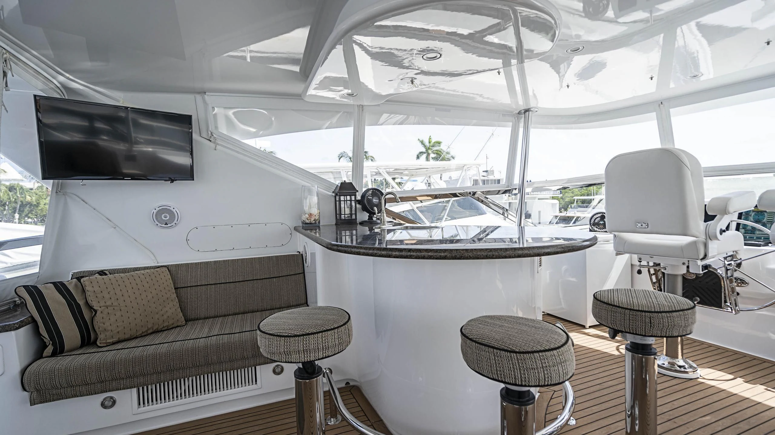 a room with a couch and a television aboard AL-JUBAIL Yacht for Sale