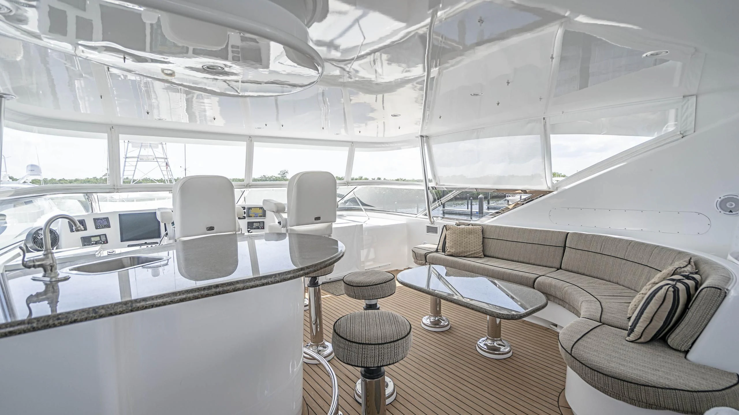 a room with a couch and a table and chairs aboard AL-JUBAIL Yacht for Sale