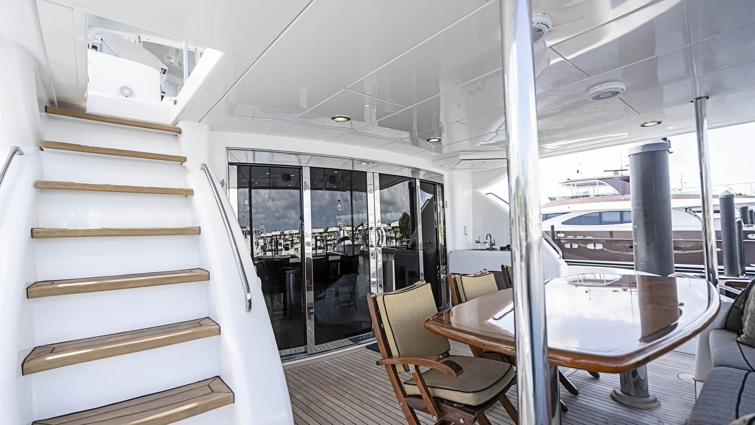 a room with a table and chairs aboard AL-JUBAIL Yacht for Sale