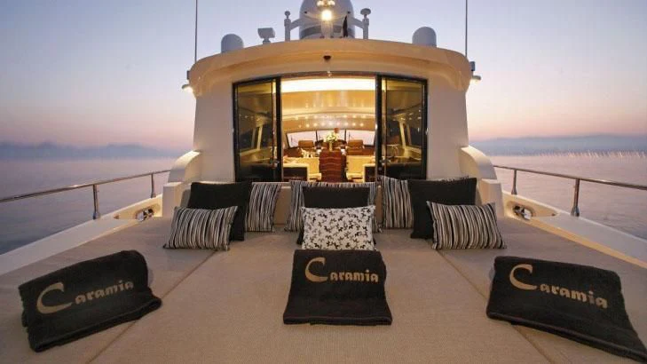a room with a sliding glass door and a view of the ocean aboard PALOMA Yacht for Sale