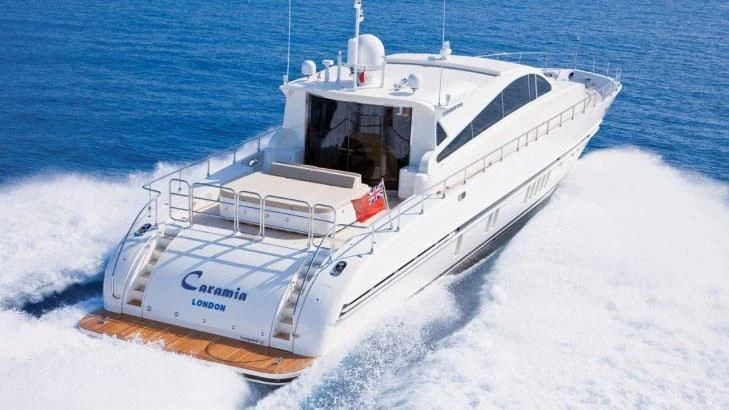 a white boat on the water aboard PALOMA Yacht for Sale
