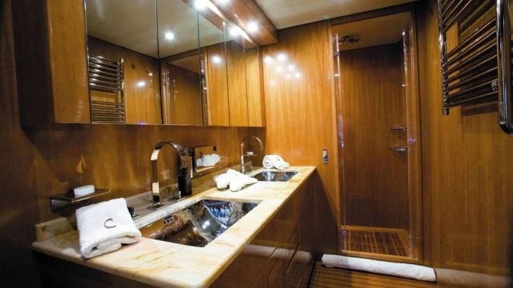 a bathroom with a sink and a mirror aboard PALOMA Yacht for Sale