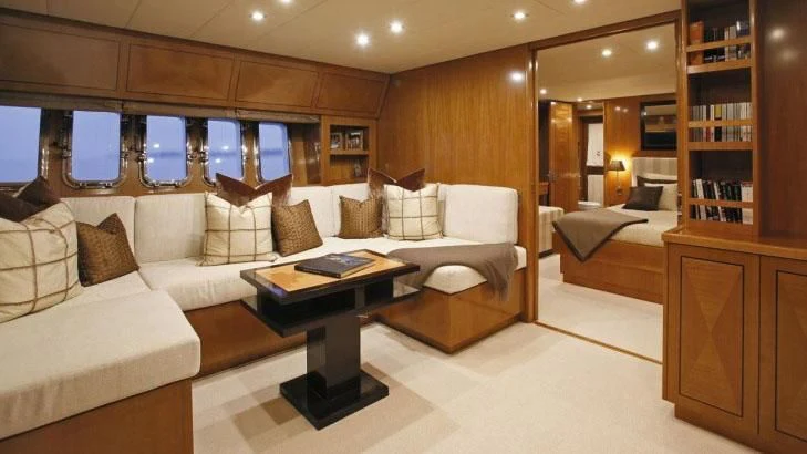 a room with a couch and a table aboard PALOMA Yacht for Sale