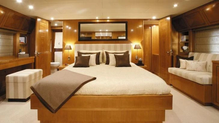 a large bed in a hotel room aboard PALOMA Yacht for Sale