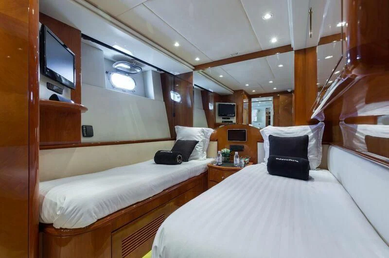a room with two beds aboard ACCAMA DELTA Yacht for Sale