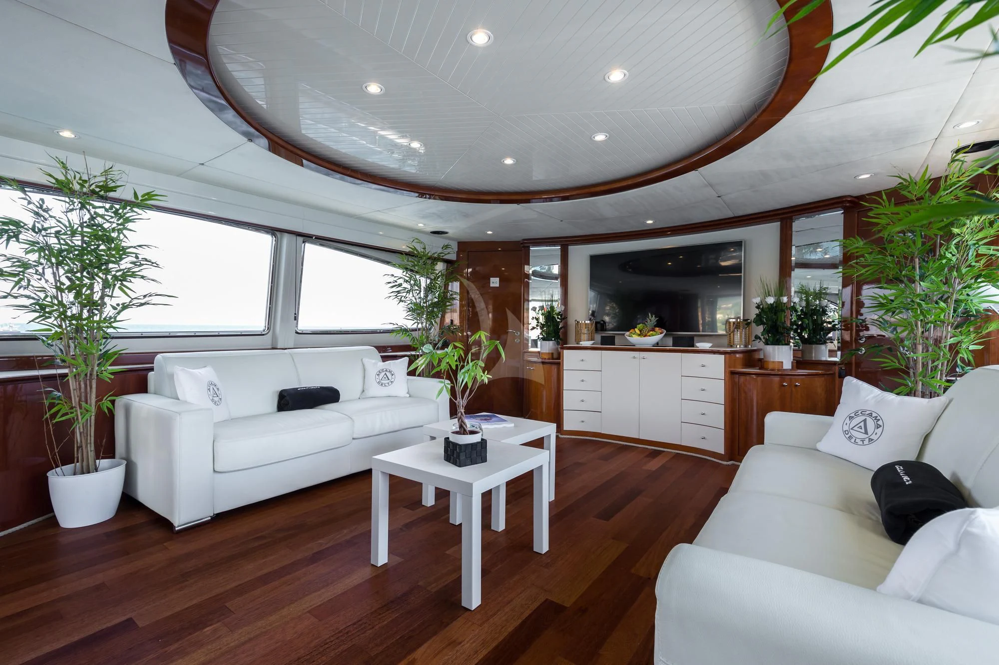 a living room with a white couch and a white sofa aboard ACCAMA DELTA Yacht for Sale