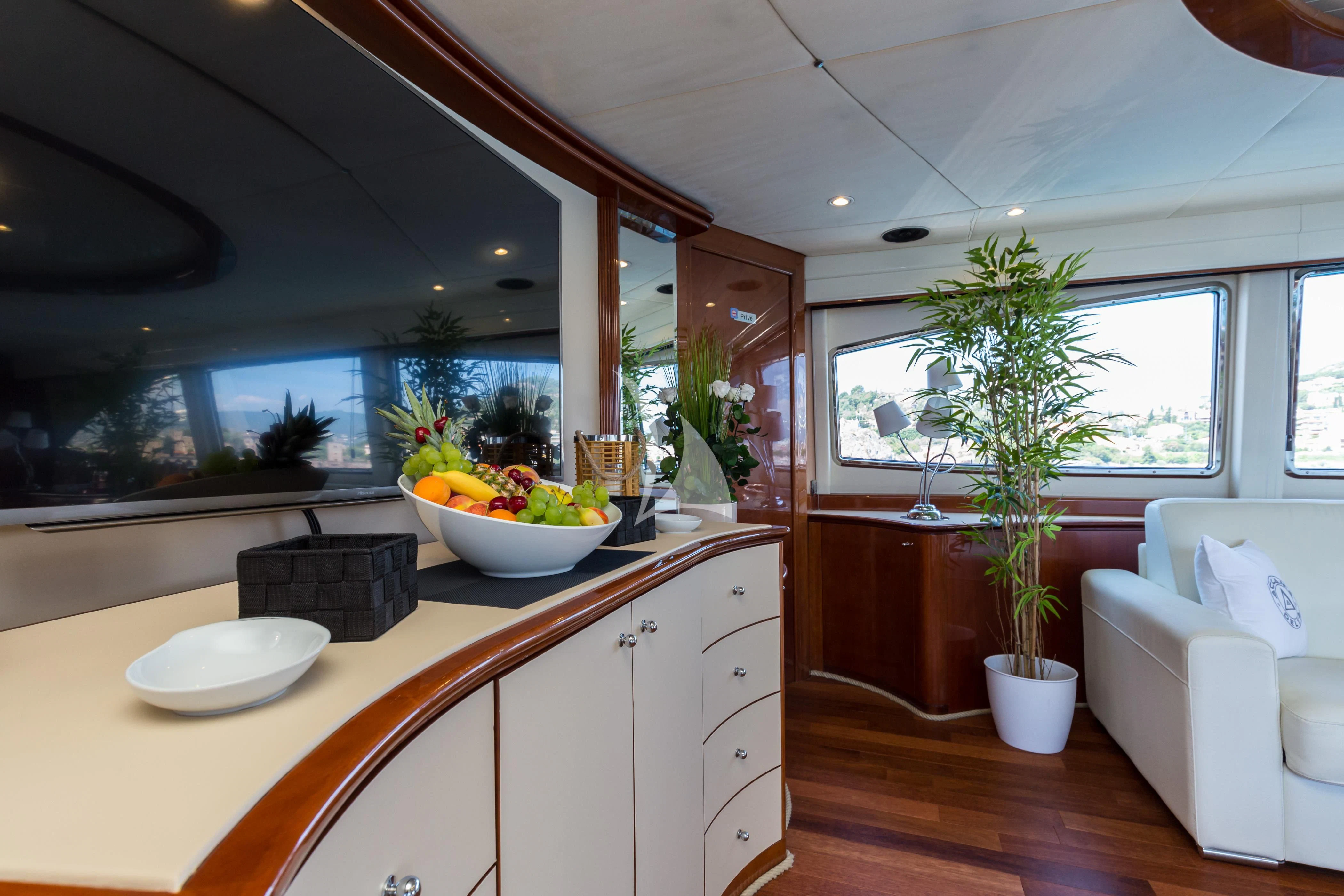 a kitchen with a plant in the pot and a window aboard ACCAMA DELTA Yacht for Sale