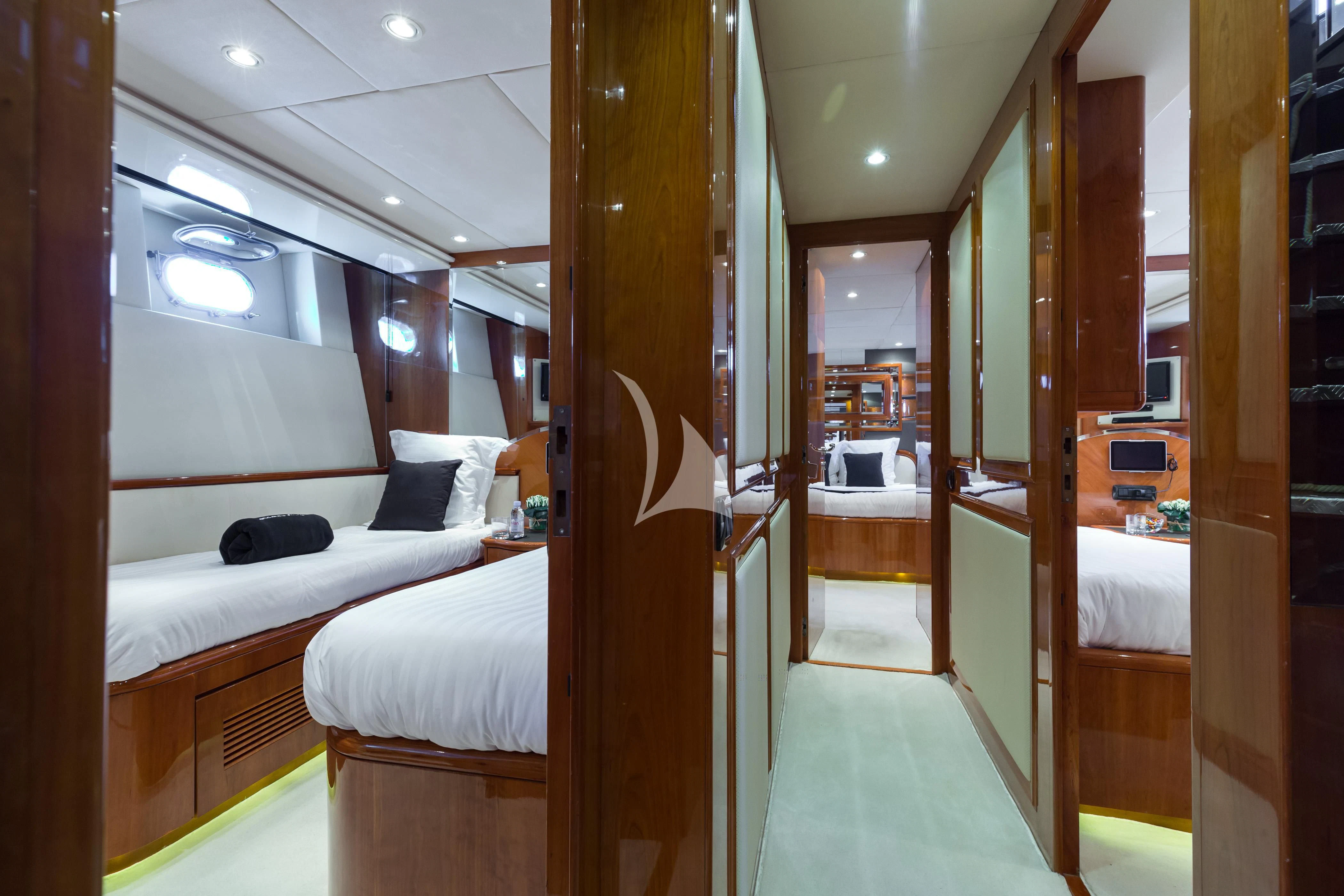 a room with a bed and a closet aboard ACCAMA DELTA Yacht for Sale