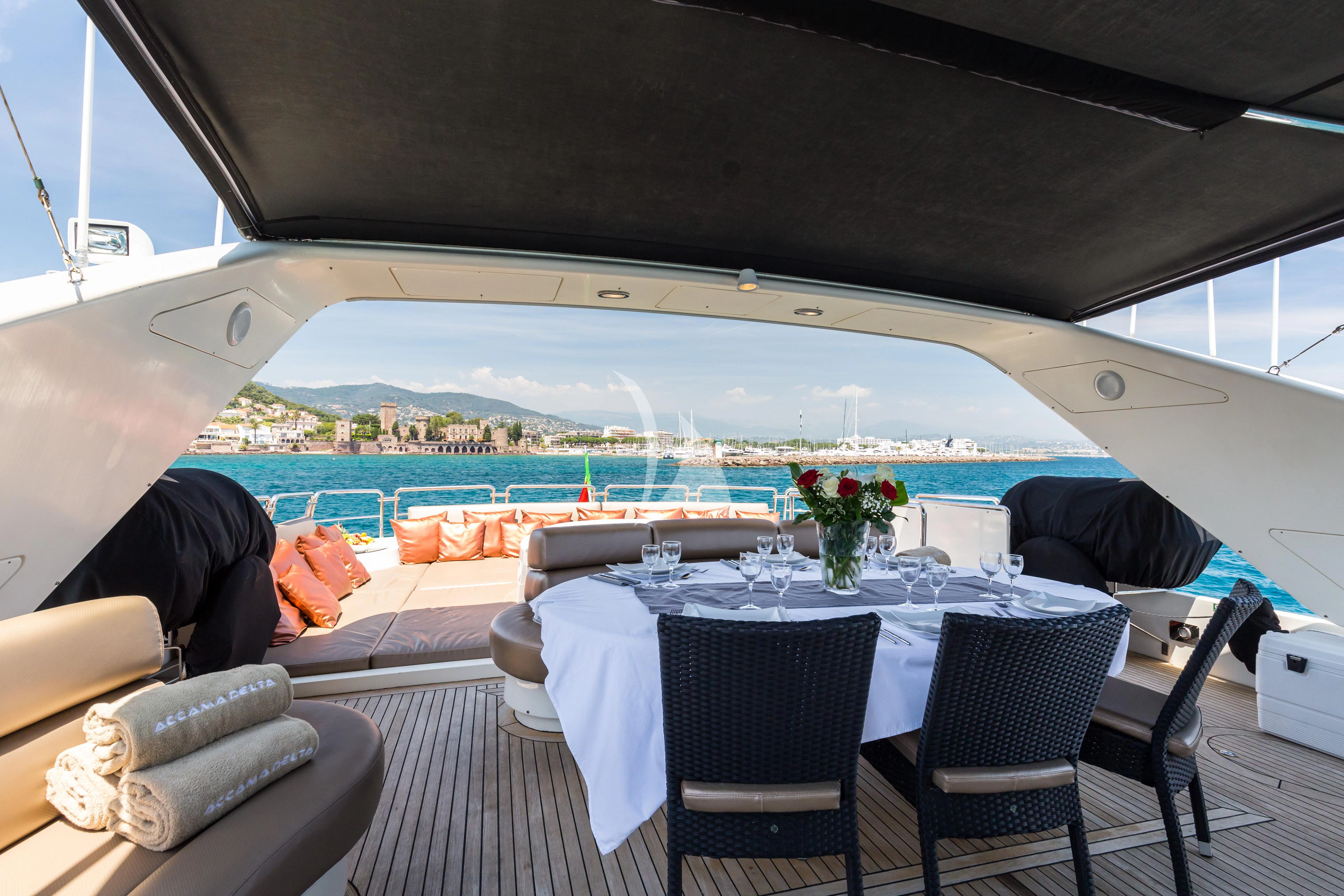 a table set for a meal aboard ACCAMA DELTA Yacht for Sale