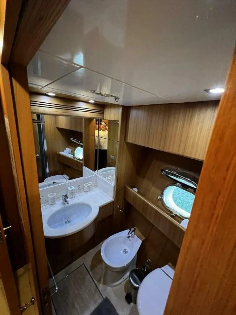 a bathroom with a large mirror aboard KOKO Yacht for Sale
