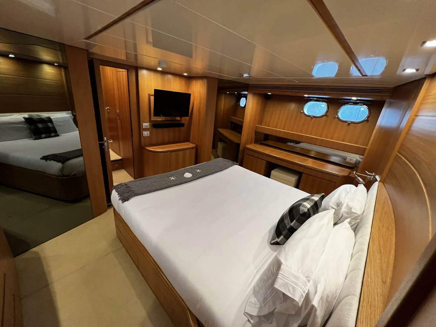 a room with a bed and a desk aboard KOKO Yacht for Sale