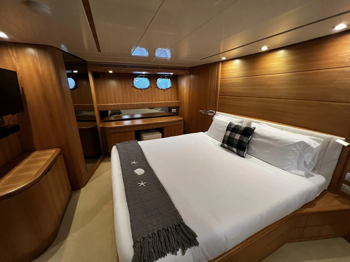 a room with a bed and a chair aboard KOKO Yacht for Sale