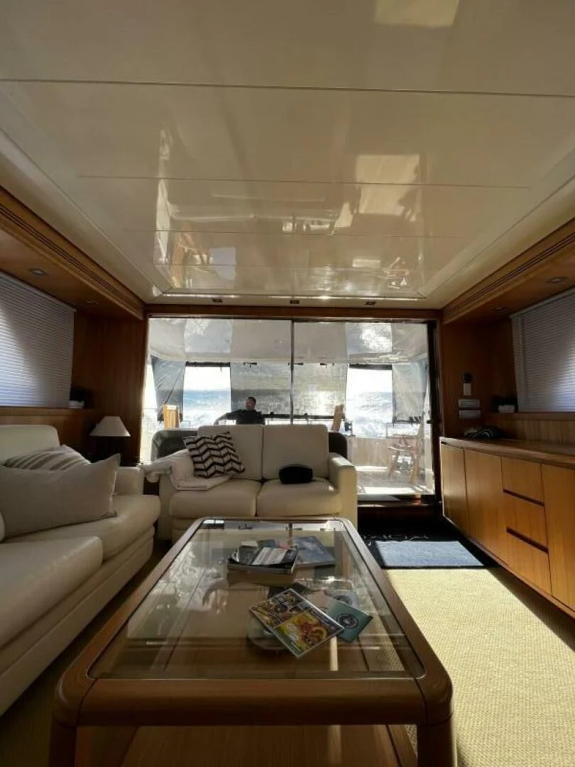 a living room with a large window aboard KOKO Yacht for Sale
