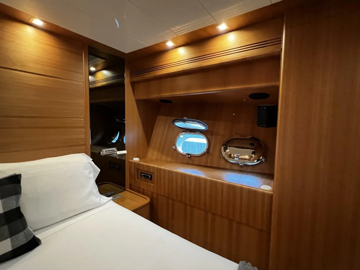 a room with a bed and a mirror aboard KOKO Yacht for Sale