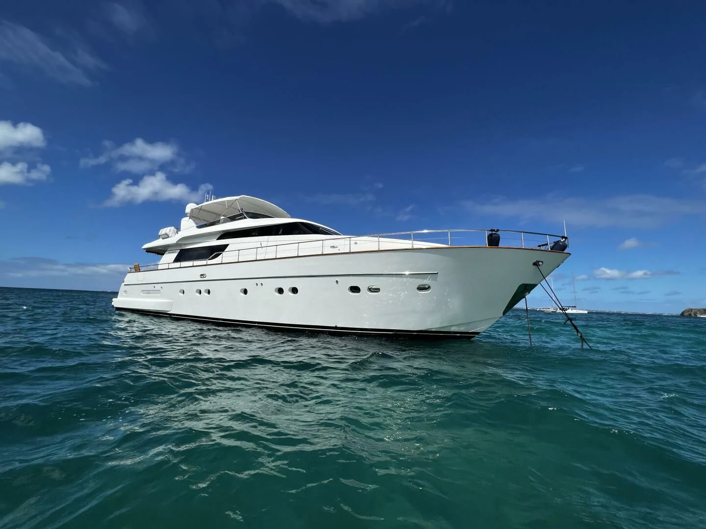 a white boat in the water aboard KOKO Yacht for Sale