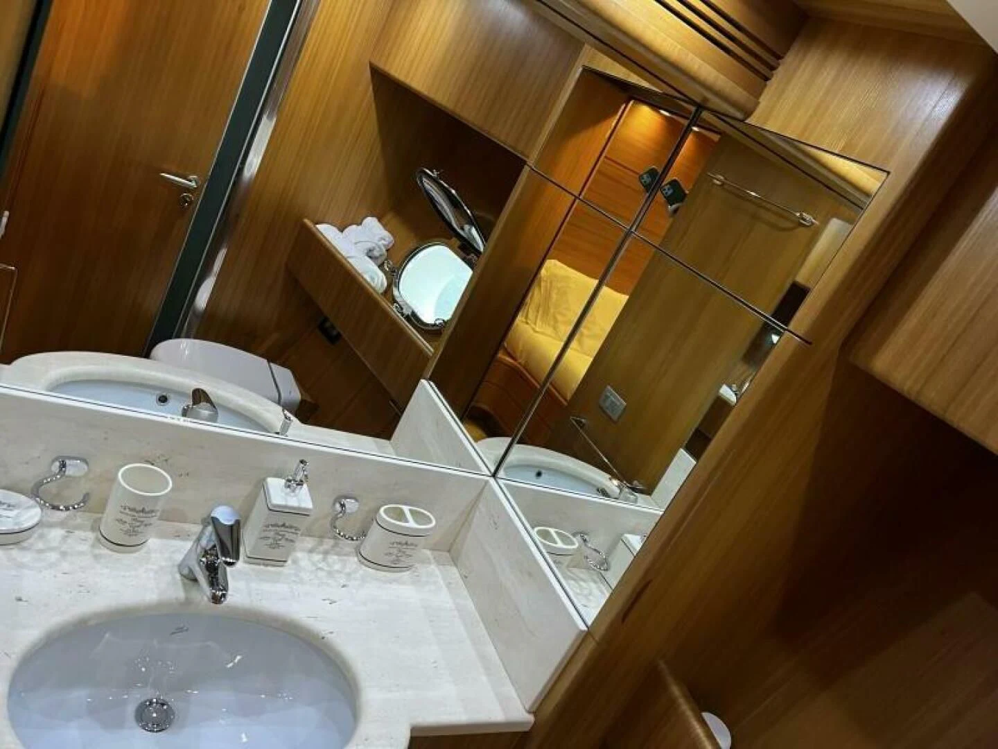 a bathroom with a large mirror aboard KOKO Yacht for Sale
