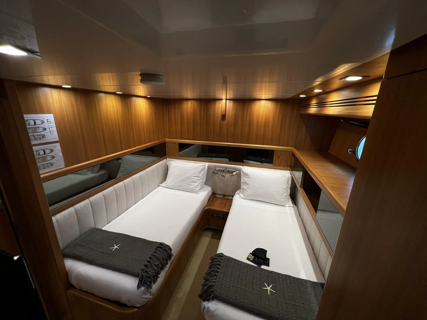 a room with beds and a window aboard KOKO Yacht for Sale