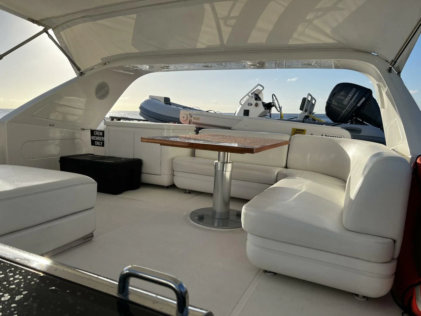 a white car with a large white boat on the deck aboard KOKO Yacht for Sale