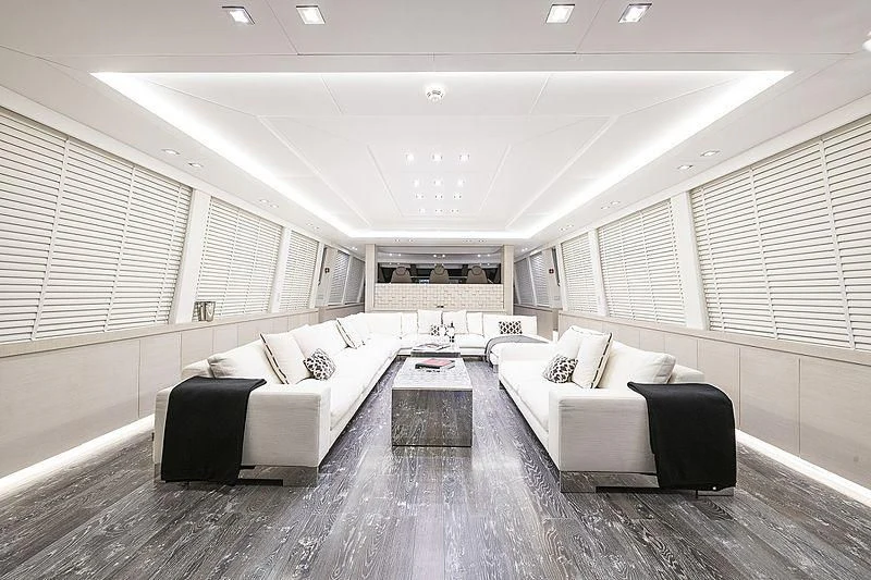a large room with a bed and a table aboard SEAFIRE Yacht for Sale
