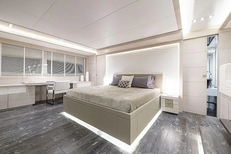 a large bedroom with a large bed aboard SEAFIRE Yacht for Sale