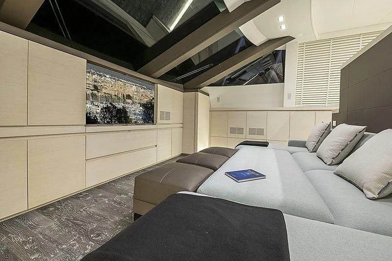a room with a bed and a couch aboard SEAFIRE Yacht for Sale