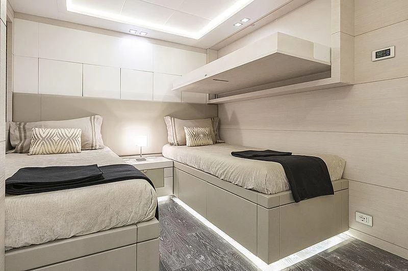 a couple of beds in a room aboard SEAFIRE Yacht for Sale