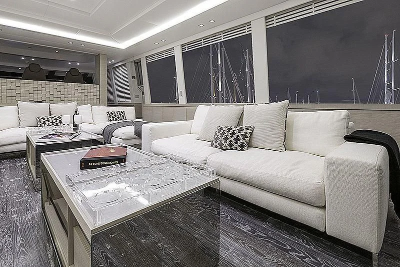 a living room with a couch and a table aboard SEAFIRE Yacht for Sale