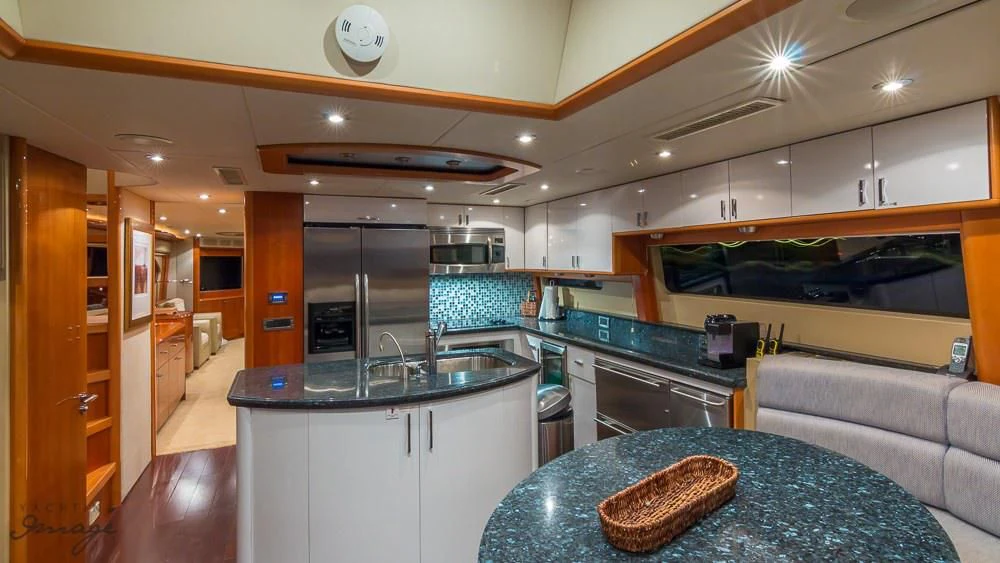 a kitchen with a large island aboard CHIP Yacht for Sale