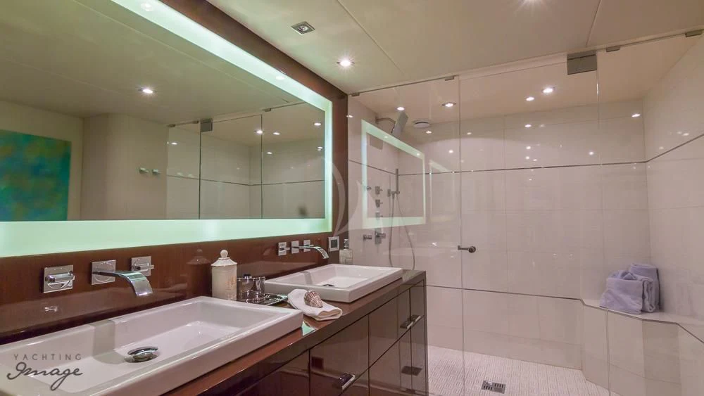 a bathroom with a large mirror aboard CHIP Yacht for Sale