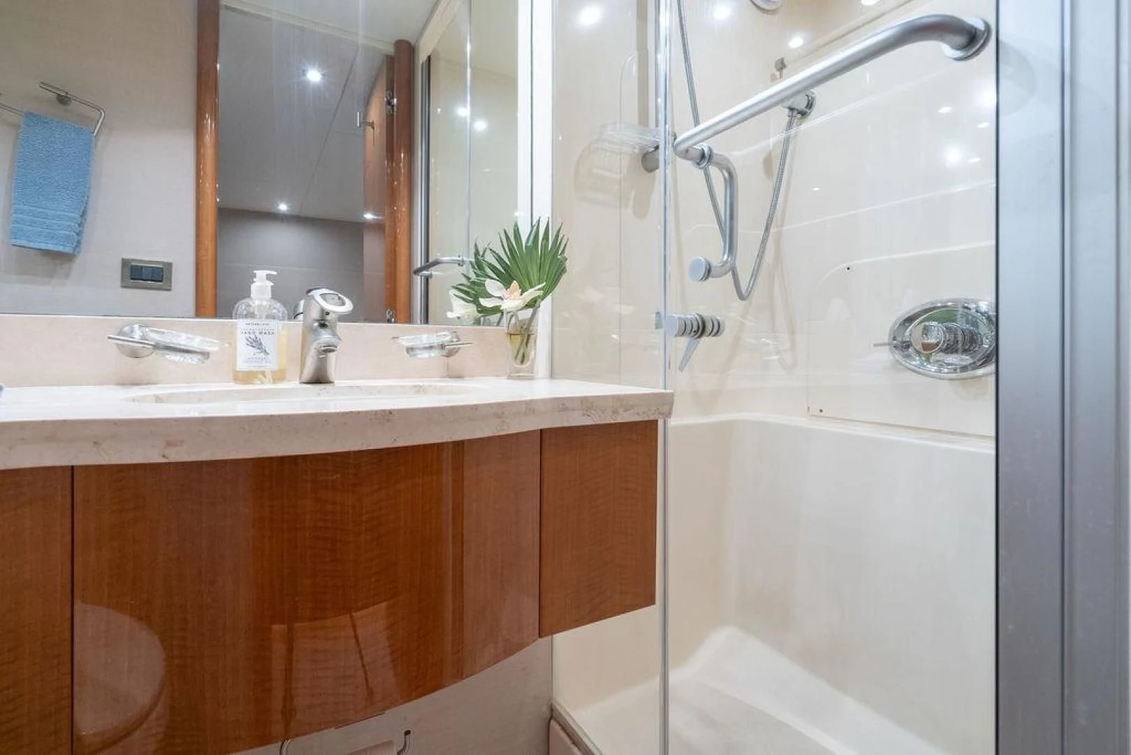 a bathroom with a shower and sink aboard CHIP Yacht for Sale