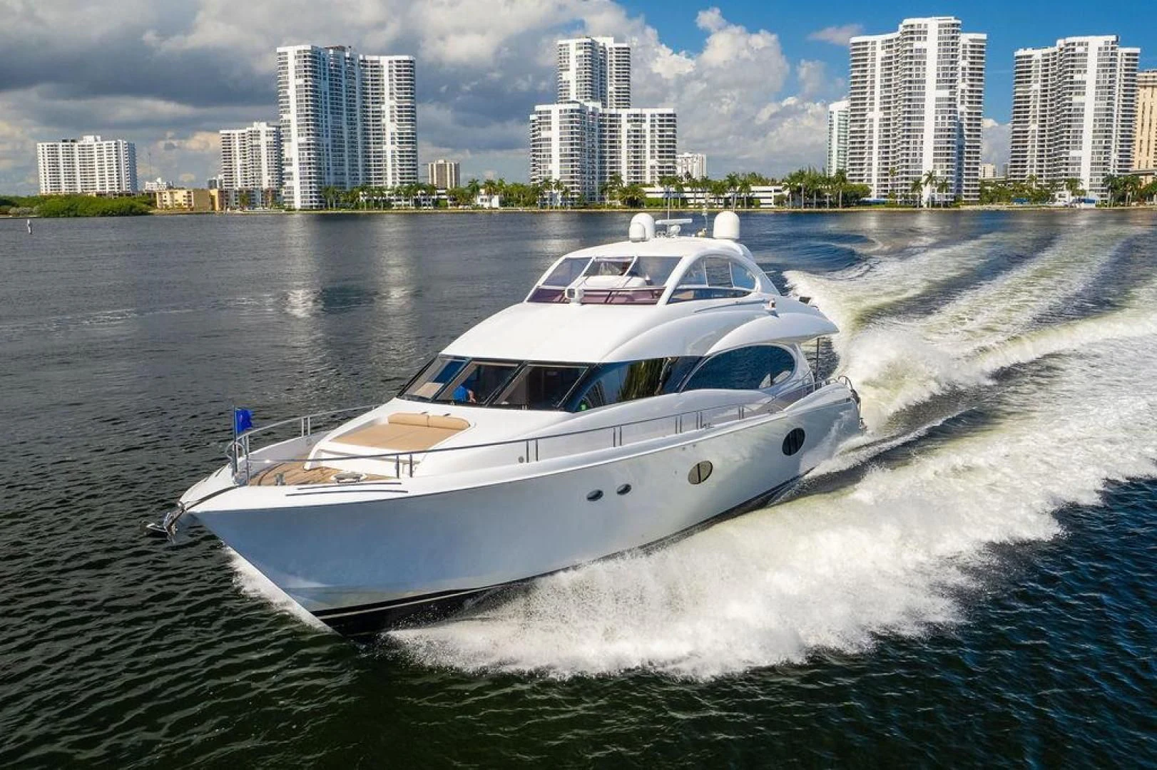 a white boat on water aboard CHIP Yacht for Sale