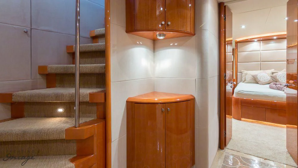 a room with a ladder and bunk beds aboard CHIP Yacht for Sale
