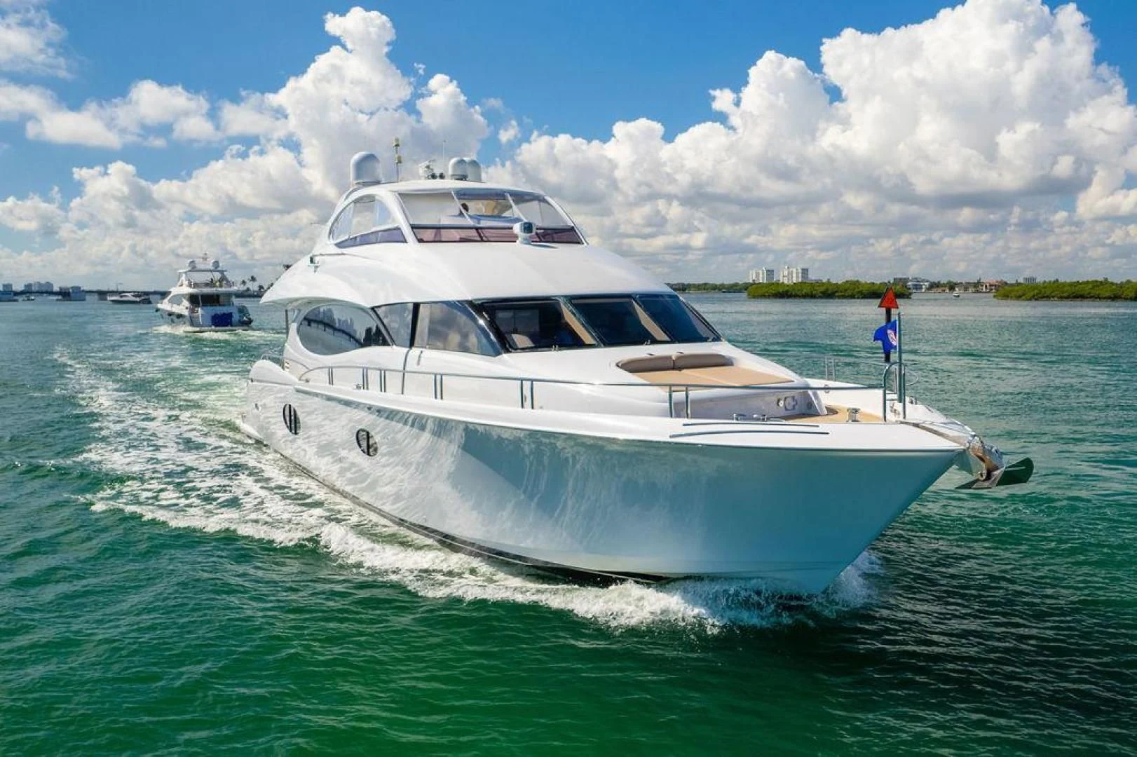 a white yacht on the water aboard CHIP Yacht for Sale