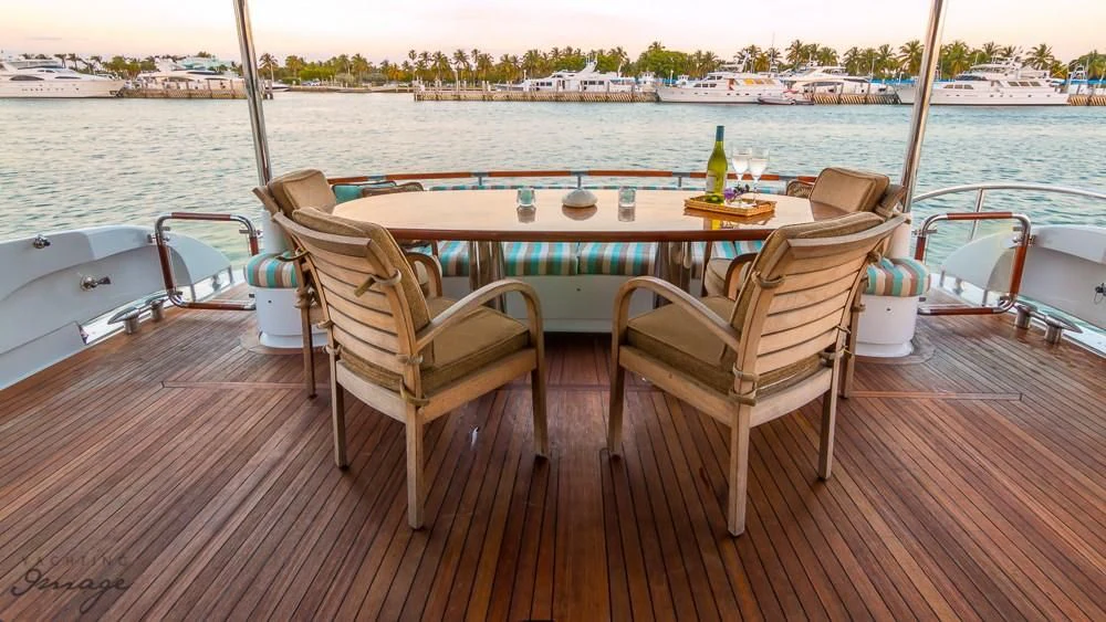 a table and chairs on a boat aboard CHIP Yacht for Sale