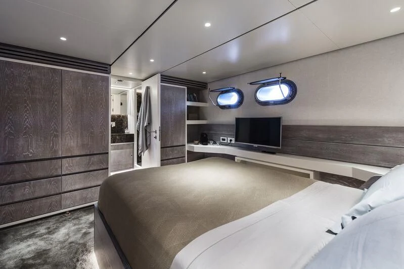 a room with a bed and a television aboard OURWAY Yacht for Sale