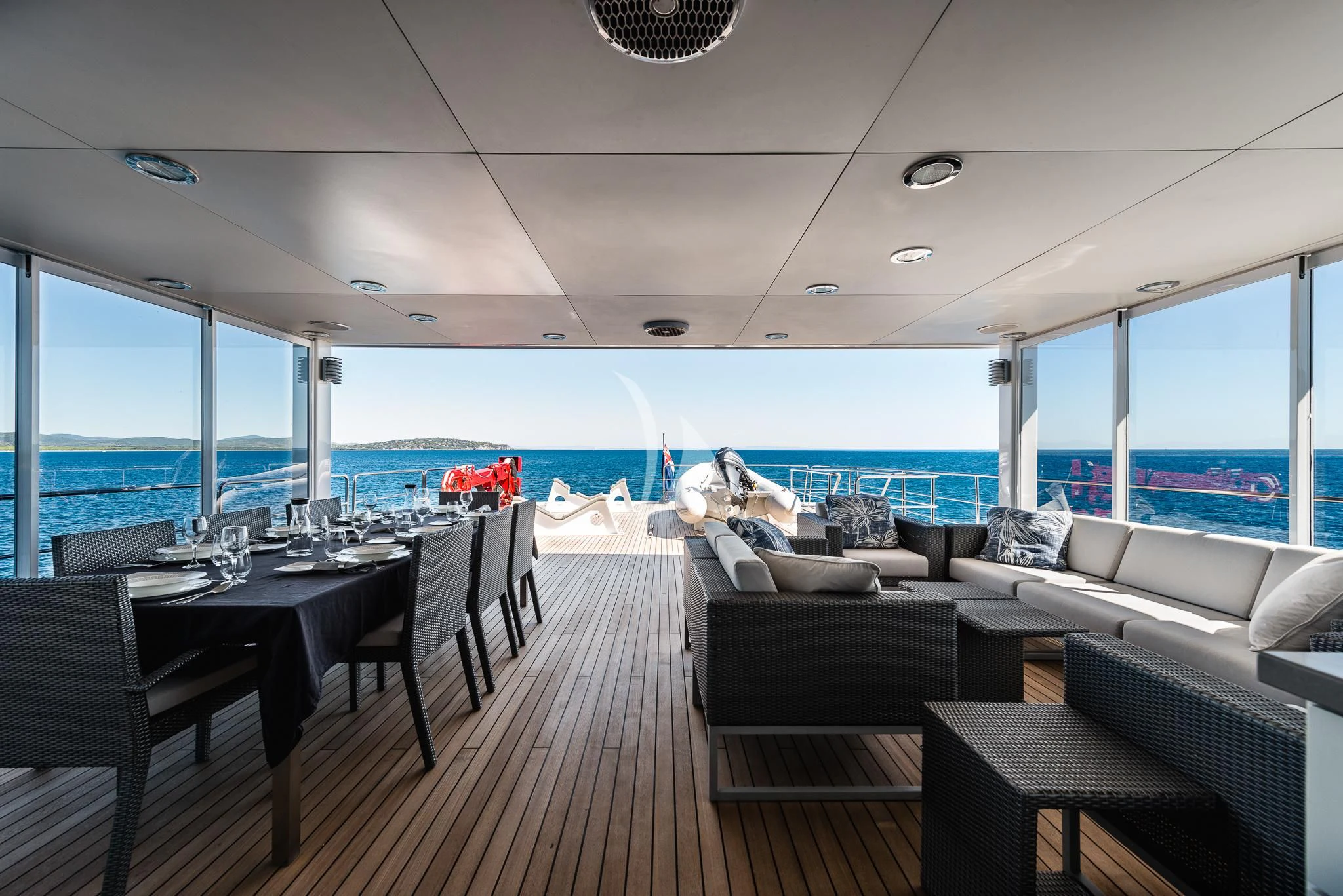 a room with a table and chairs aboard OURWAY Yacht for Sale