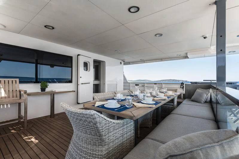 a living room with a couch and a table aboard OURWAY Yacht for Sale